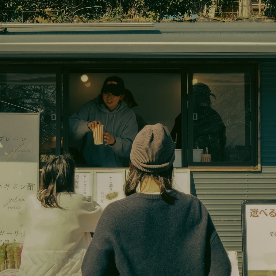 Customers ordering at a food truck window